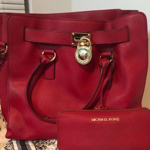 Red Michael Kors tote and wallet